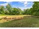Well-maintained horse paddock featuring secure fencing on a grassy area perfect for equestrian activities at 536 Brookhaven Rd, Statesville, NC 28625