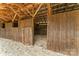 Horse stalls featuring wood framing provide a secure and comfortable space for housing animals on the property at 536 Brookhaven Rd, Statesville, NC 28625