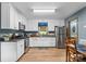 Well-lit kitchen with stainless steel appliances and white cabinetry at 536 Brookhaven Rd, Statesville, NC 28625