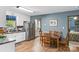 Bright kitchen with stainless steel appliances and an adjacent dining area at 536 Brookhaven Rd, Statesville, NC 28625