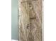 Shower featuring a marble-like wall, shower head, handle, and a built-in soap shelf at 536 Brookhaven Rd, Statesville, NC 28625