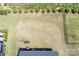 An aerial view shows a large manicured lawn with fencing and a garden box at 5727 Lavaux Ct, Charlotte, NC 28214