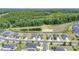 Aerial view of neighborhood showcasing well-manicured lawns, and a tranquil pond at 5727 Lavaux Ct, Charlotte, NC 28214