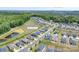 Community aerial view showcasing ponds, nature, and a distant view of Charlotte at 5727 Lavaux Ct, Charlotte, NC 28214