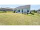 View of the backyard with a covered patio and some lawn at 5727 Lavaux Ct, Charlotte, NC 28214