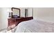 Bedroom with wooden furniture, neutral walls, and light carpet at 5727 Lavaux Ct, Charlotte, NC 28214
