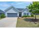 Charming single-story home featuring a well-maintained lawn, two car garage, and attractive curb appeal at 5727 Lavaux Ct, Charlotte, NC 28214