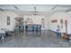 Organized garage with epoxy flooring, storage shelving, and ample space for parking and projects at 5727 Lavaux Ct, Charlotte, NC 28214