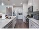 Modern kitchen with stainless steel appliances, granite countertops, and ample cabinet space at 5727 Lavaux Ct, Charlotte, NC 28214