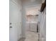 Clean laundry room with tile floors and modern appliances at 5727 Lavaux Ct, Charlotte, NC 28214