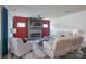 Open-concept living room with fireplace and large windows providing natural light at 5727 Lavaux Ct, Charlotte, NC 28214