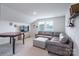 Relaxing living room with a large sectional sofa, a tv and natural light from the window at 5727 Lavaux Ct, Charlotte, NC 28214