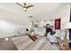 Spacious living room with modern furnishings, hardwood floors, and an open concept design to the kitchen at 5727 Lavaux Ct, Charlotte, NC 28214