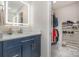 Bathroom vanity with backlit mirror and a view into the walk in closet at 6040 Morris Farm Ln, Mint Hill, NC 28227