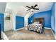 Accent walled bedroom with an adjacent window and light-toned carpet at 6040 Morris Farm Ln, Mint Hill, NC 28227