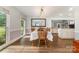 Bright dining room showcasing a view of the living room and kitchen, creating an inviting and airy atmosphere at 6040 Morris Farm Ln, Mint Hill, NC 28227