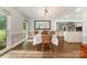 Bright dining room showcasing a view of the living room and kitchen, creating an inviting and airy atmosphere at 6040 Morris Farm Ln, Mint Hill, NC 28227