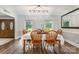 Dining room with seating for six features natural light and a view of the front yard at 6040 Morris Farm Ln, Mint Hill, NC 28227