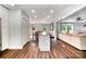 Open layout with kitchen island and dining area; great for entertaining with access to the living room at 6040 Morris Farm Ln, Mint Hill, NC 28227