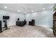 A bright office with neutral carpet, ceiling fan, and base trim at 6040 Morris Farm Ln, Mint Hill, NC 28227