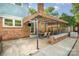 Covered brick patio with awning and outdoor dining set at 6040 Morris Farm Ln, Mint Hill, NC 28227