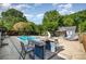 Backyard pool and pool house with bar and outdoor seating at 6040 Morris Farm Ln, Mint Hill, NC 28227
