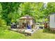 Back yard featuring a gazebo, a grill and mature trees at 622 Neelys Creek Rd, Rock Hill, SC 29732