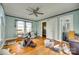 Bedroom with hardwood floors, light blue walls, a ceiling fan and white trim, with adjoining bath at 622 Neelys Creek Rd, Rock Hill, SC 29732