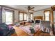 Spacious living room with hardwood floors, fireplace, and natural light from large windows at 622 Neelys Creek Rd, Rock Hill, SC 29732