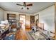 Spacious living room with hardwood floors, ceiling fan, natural light and built in bookcases, with an adjoining room at 622 Neelys Creek Rd, Rock Hill, SC 29732