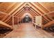 An unfinished attic space with wooden beams, providing potential for storage or renovation at 7103 Forest Ridge Rd, Matthews, NC 28104