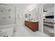 All-white bathroom features double vanity and large glass shower at 7103 Forest Ridge Rd, Matthews, NC 28104