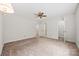Spacious bedroom with neutral walls and multiple closets and ceiling fan at 7103 Forest Ridge Rd, Matthews, NC 28104