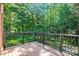 Large deck with wrought iron railing, perfect for entertaining and enjoying the view at 7103 Forest Ridge Rd, Matthews, NC 28104