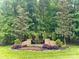 Landscaped entrance to Providence Place, featuring stone pillars and manicured greenery at 7103 Forest Ridge Rd, Matthews, NC 28104