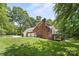 Beautiful brick home featuring a well-maintained lawn and a spacious three-car garage at 7103 Forest Ridge Rd, Matthews, NC 28104