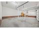 Spacious three-car garage with ample storage, convenient sink, and access to home interior at 7103 Forest Ridge Rd, Matthews, NC 28104
