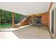Covered patio with outdoor staircase, offers a perfect space for storage at 7103 Forest Ridge Rd, Matthews, NC 28104
