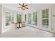 Bright sitting room featuring large windows, French doors, and comfortable seating at 7103 Forest Ridge Rd, Matthews, NC 28104