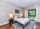 Cozy bedroom with natural light, a comfortable bed, and stylish decor at 715 N Church St # 213, Charlotte, NC 28202