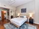Comfortable bedroom featuring modern decor, with an attached closet and ensuite at 715 N Church St # 213, Charlotte, NC 28202