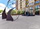Modern sculpture outside a condo building enhancing the exterior appeal at 715 N Church St # 213, Charlotte, NC 28202