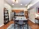 Open kitchen with stainless steel appliances and a dining area with seating for four at 715 N Church St # 213, Charlotte, NC 28202
