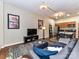 This comfy living room features sleek decor, a large television, and an open flow to a modern kitchen and dining area at 715 N Church St # 213, Charlotte, NC 28202