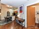 View of the kitchen and dining space near the entrance to the full bathroom at 715 N Church St # 213, Charlotte, NC 28202