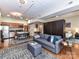 Open-concept living space featuring a modern kitchen, cozy living area, and a partially divided bedroom for privacy at 715 N Church St # 213, Charlotte, NC 28202