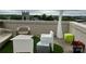 This rooftop deck offers a serene seating area with city views at 715 N Church St # 213, Charlotte, NC 28202