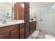 Bathroom with double vanities, generous storage and a bath at 7341 Adare Mews Rd, Charlotte, NC 28217