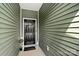 Welcoming entryway featuring a stylish black door with a decorative wreath and cozy decor at 7341 Adare Mews Rd, Charlotte, NC 28217