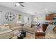 Comfortable living room with a sectional sofa, pendant lighting, and an open layout at 7341 Adare Mews Rd, Charlotte, NC 28217